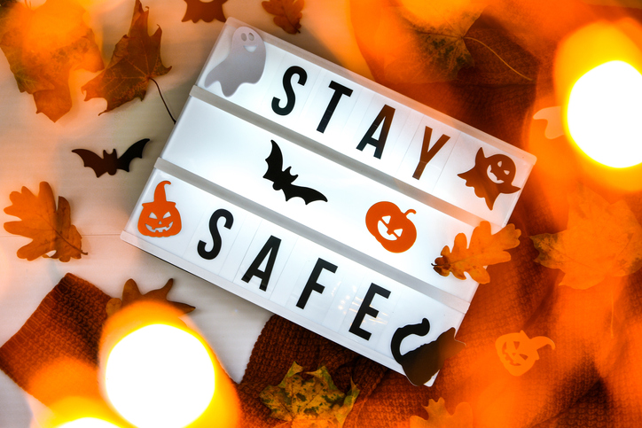 graphic showing "Stay Safe" on a Halloween background