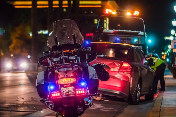 Damaged car pulled over after a rear-end accident