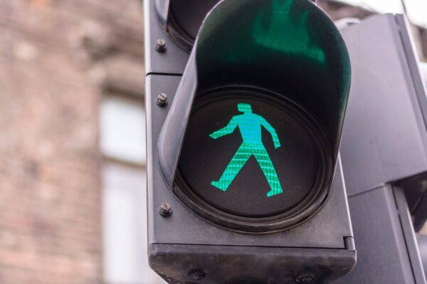 Green light for a pedestrian to cross the road.