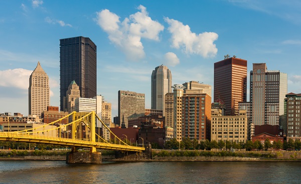 A picturesque view of the downtown Pittsburgh skyline, featuring a mix of modern and historic buildings.