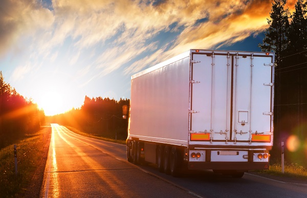 A tractor-trailer on the highway.